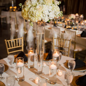 White floral centerpiece with gold accents.   Floral and Decor by Southern Event Planners