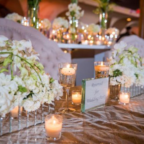 White, gold and mirrored centerpieces for a New Year's Eve wedding  Floral and Decor by Southern Event Planners